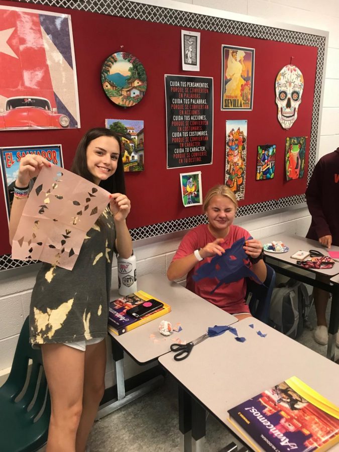 Annie Castro, 10, and Payton Mayo, 10, engage in a fun activity during Spanish Club. 