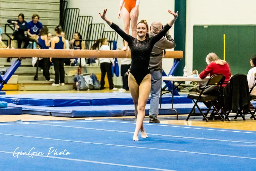 Paige Perez, 12, performing at a Gymnastics meet.