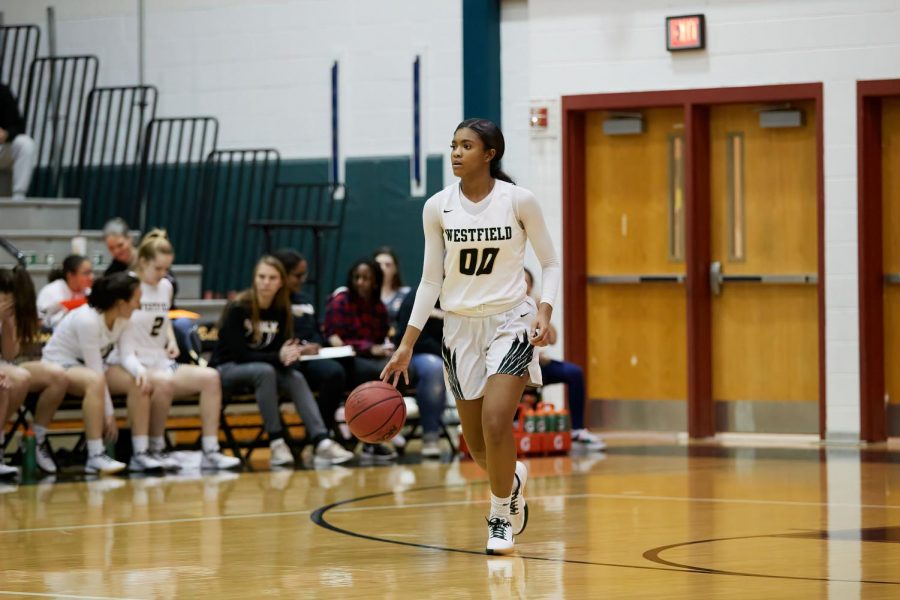Reed brings the ball up the floor in a game against Centreville last year.