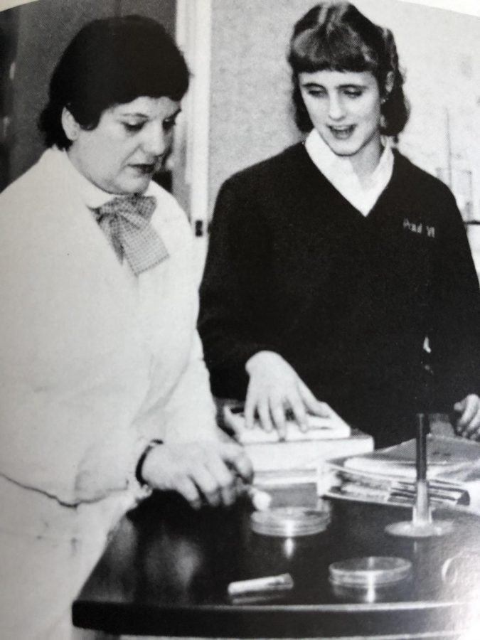 The author, Dr. Carol Raphael, conducts a chemistry experiment with a student at Paul VI High School, circa 1988.