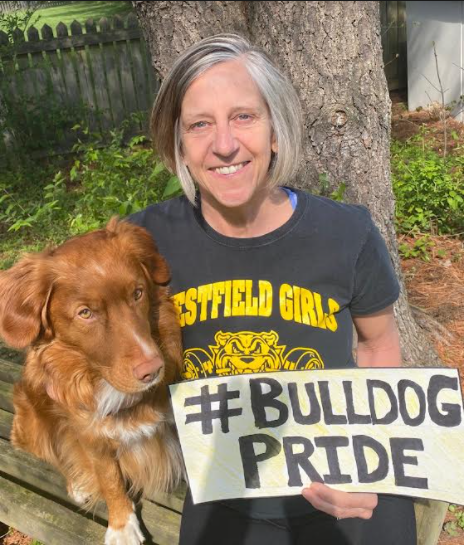 Cudahy showing off her Bulldog pride with her dog, Barley.
