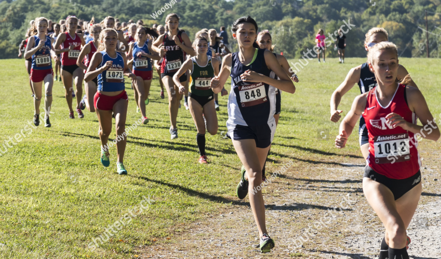 Students running during Cross Country practice. 