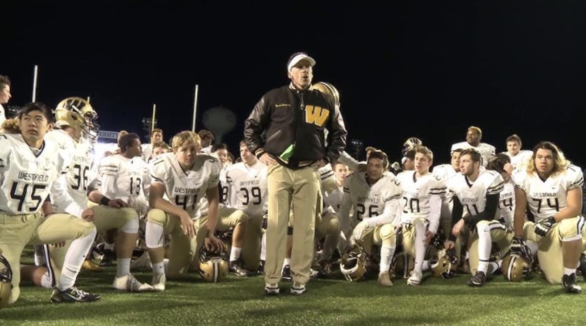 Westfield+Football+Coach+Kyle+Simmons+in+front+of+his+team+before+a+big+playoff+game.+