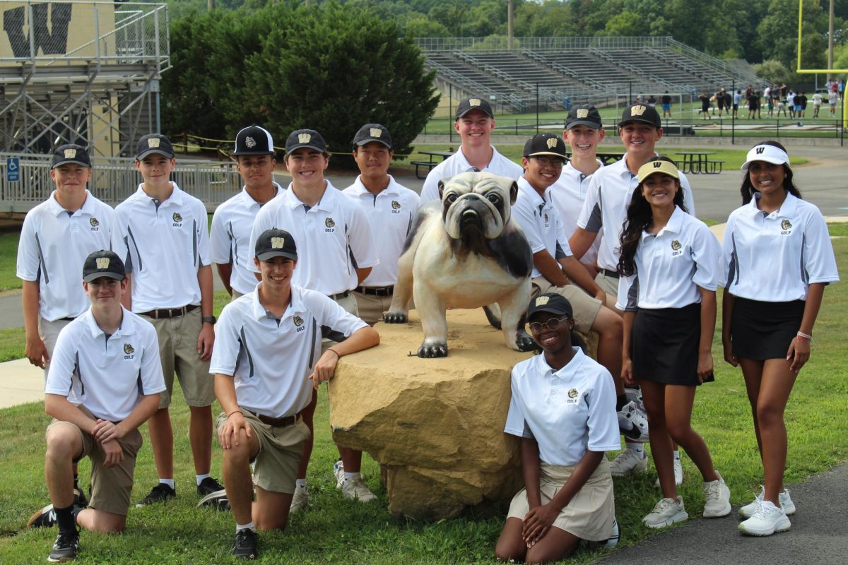 Westfield Golf Team gathers around the Bulldog mascot.
